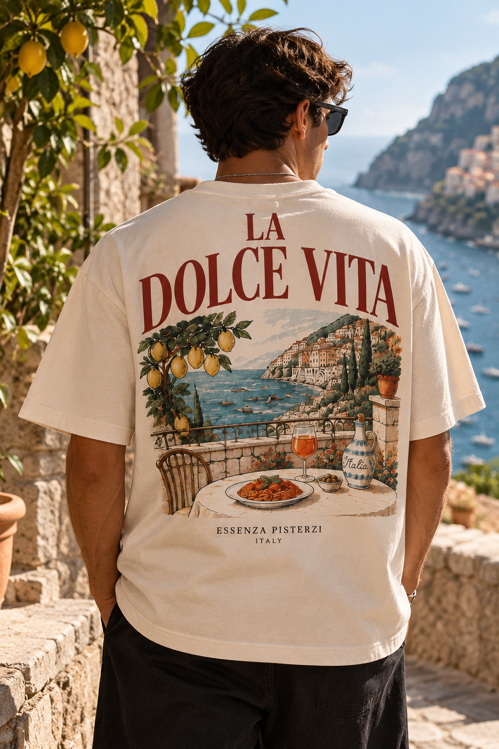 Model wearing Essenza Pisterzi La Dolce Vita T-shirt on Italian coastal terrace